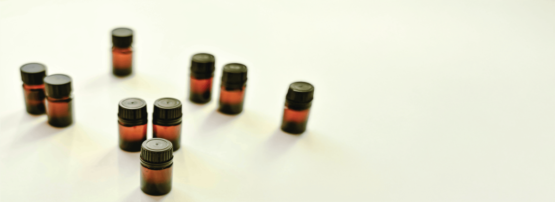 Essential oil bottles on a light background